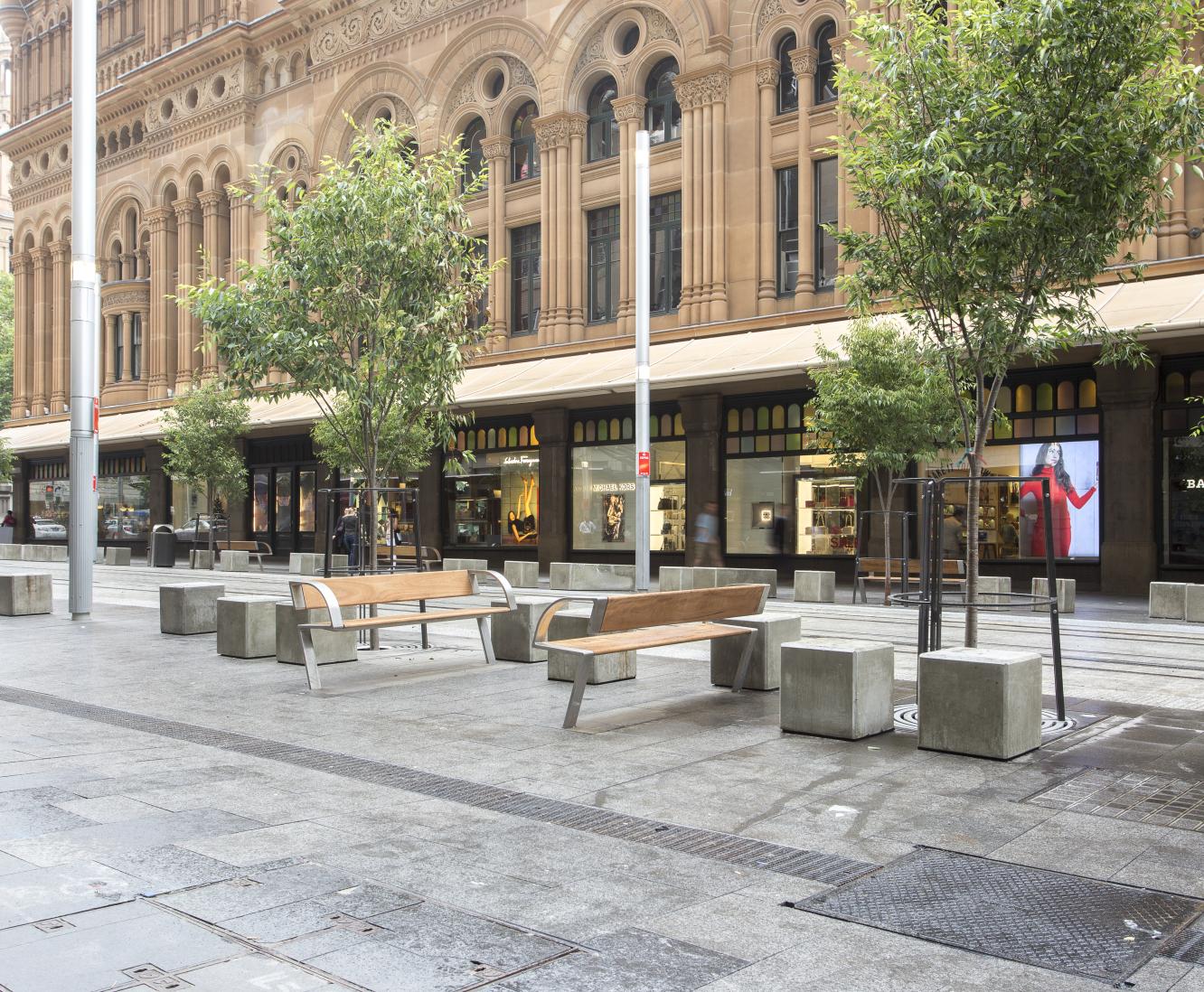 Outdoor seating area next to light rail